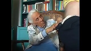 Elderly woman experiences intense pleasure in a group encounter.