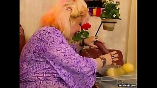 Feisty grandma dives deep inside with her stubby fingers, relishing a wild group sex session.